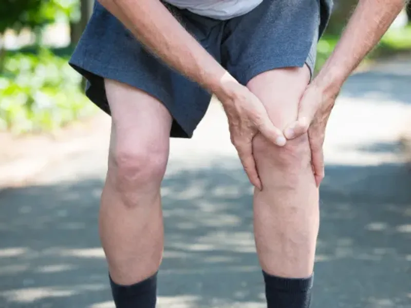 Therapist rehabilitating a patient's knee after an ACL injury