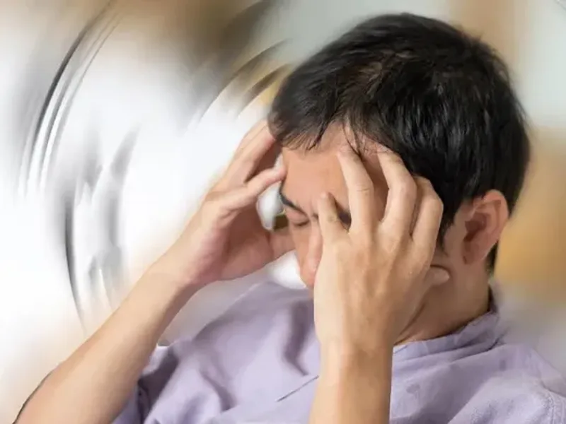Physical therapist assessing a patient's vestibular system and dizziness