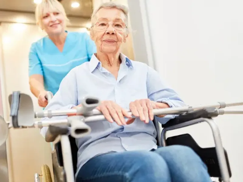 Physical therapist guiding a stroke survivor through rehabilitation
